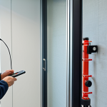 **

*   A fire safety technician inspecting a sprinkler system in a modern office building (perhaps La Défense). Focus on the technician's detailed and careful approach. Emphasize technology and equipment.

**